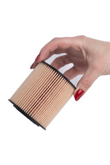 Oil filter in hand on white background