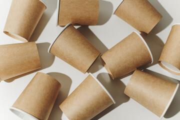 Many Recyclable Cardboard Disposable Cups on White.