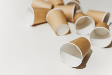 Many Recyclable Cardboard Disposable Cups on White.