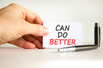 Can do better symbol. Concept words Can do better on beautiful white card. Beautiful white background. Businessman hand with pen. Business and can do better concept. Copy space.