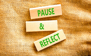 Pause and reflect symbol. Concept words Pause and reflect on beautiful block. Beautiful canvas...
