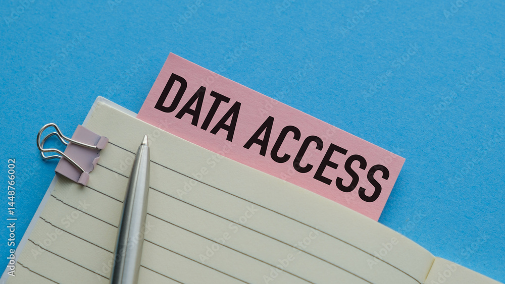 Poster a pen is sitting on a notebook with a pink label that says data access