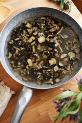 Home preparation of comfrey root ointment using rendered pork lard