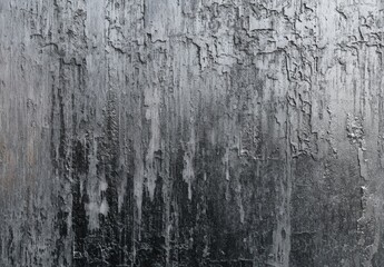 Textured abstract background with black and gray gradient tones, resembling weathered surfaces.