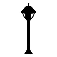 Silhouette of an outdoor streetlight with a decorative top and base