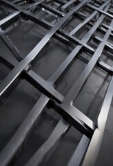 Obraz premium Sleek steel, intersecting lines, polished finish , reflective, modern design