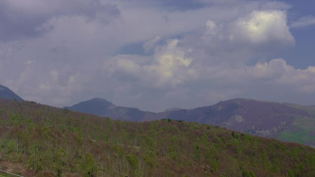 Timelapse of Fast Moving Cloud Formations Over Mountain Peaks