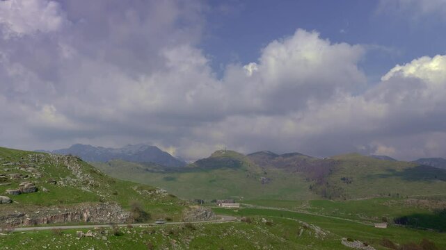 Timelapse of Fast Moving Cloud Formations Over Mountain Peaks