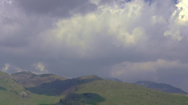 Timelapse of Fast Moving Cloud Formations Over Mountain Peaks