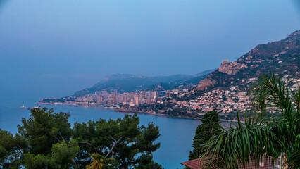 Fototapeta premium Cityscape of Monte Carlo night to day timelapse, Monaco before summer sunrise.