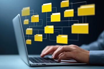 Folder hierarchy structure and document management system DMS. Businessman using laptop computer for saving and classifying files.
