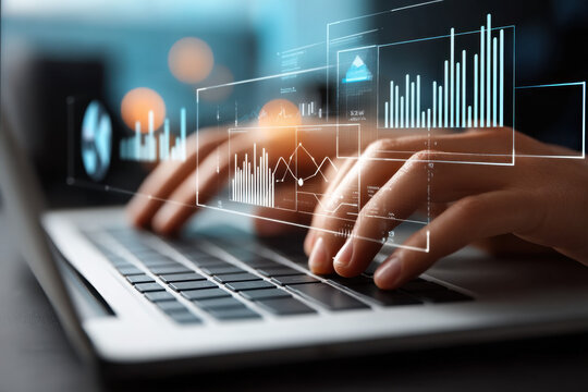 Data analytics and graphs. Analysis of statistical business marketing data. Data scientist using laptop computer to analyze data.
 - Powered by Adobe
