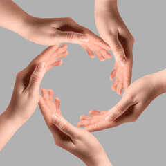 Making circle of human hands on grey background. Unity, partnership, cooperation