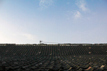 view of clear blue sky above the roof of the house