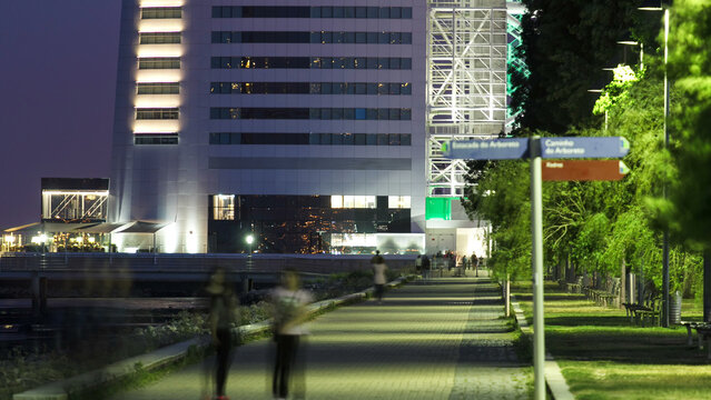 Walkway near Hotel Tower in the Park of the Nations timelapse from day to night