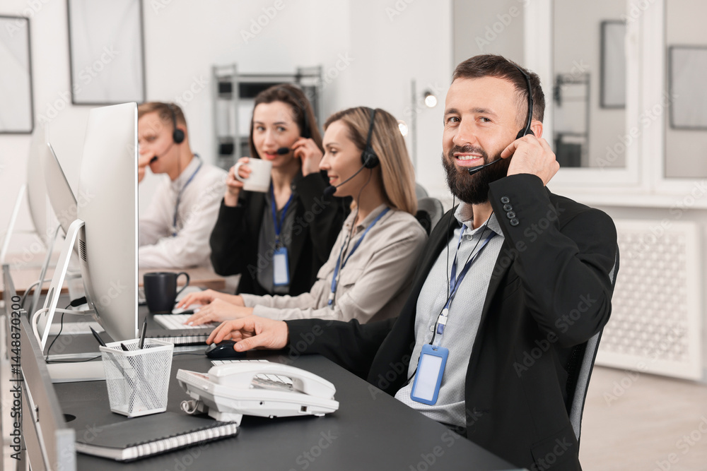 Poster technical support call center. team of operators working in office