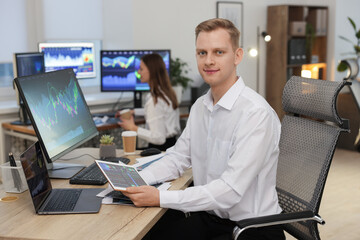 Stock exchange. Man working at desk in office