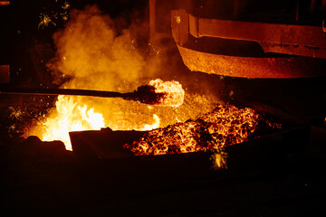 Removing slag from surface of hot iron in melting furnace
