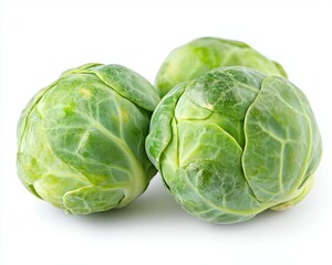 Close Up of Three Fresh Green Brussels Sprouts on White Background with Detailed Leaf Texture and Vibrant Color