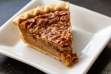 Close-up of piece of pecan pie on plate