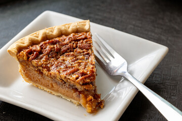 Close-up of piece of pecan pie on plate