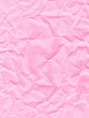 folded pink crumpled paper texture background