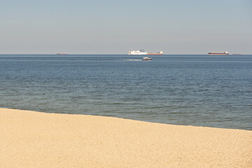 A boat is in the water near the shore