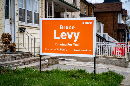 Campaign sign of New Democrat Party (NDP) candidate Bruce Levy in Toronto. Toronto, Canada - April 25, 2025.