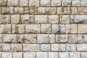 Clean stone wall of the building.