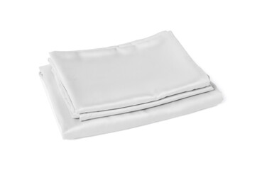Stack of silky bed linens on white background
