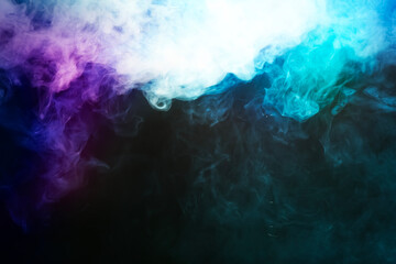 Bright color smoke in air on black background