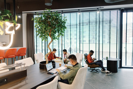 Young IT company team of marketers, developers and programmers working