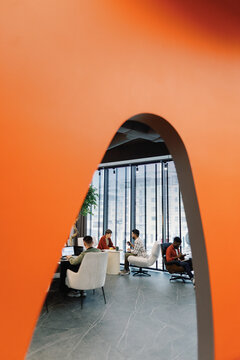 Young creative multiethnic team of digital company working on project