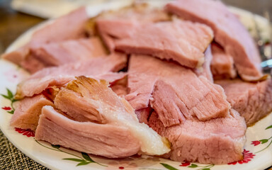 Sliced Ham On A Serving Plate With Bokeh