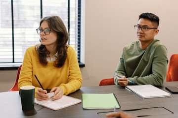 Young multiracial IT company team listening someone during meeting