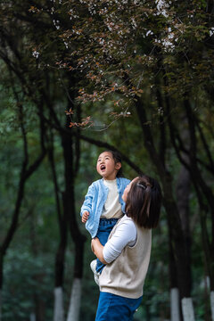 little girl enjoy the spring day with mother