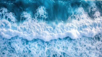 Obraz premium aerial view showcasing the vibrant turquoise ocean and white foa