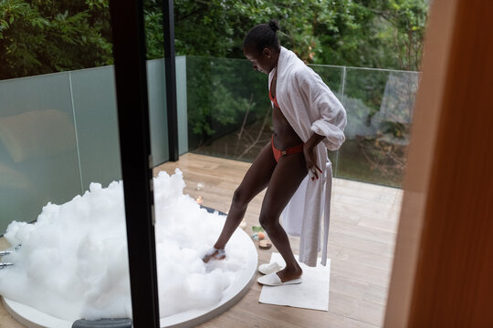 Woman preparing to enjoy hot tub