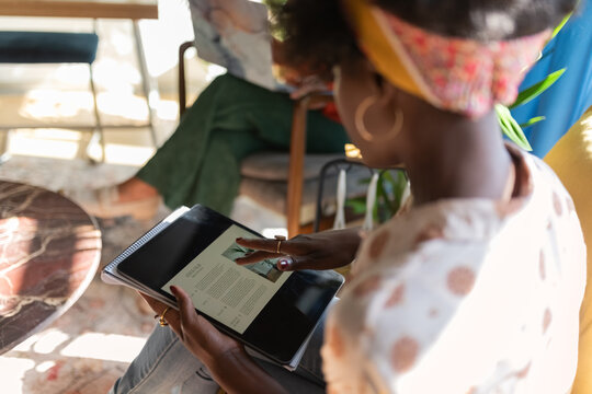 Woman using tablet computer at office