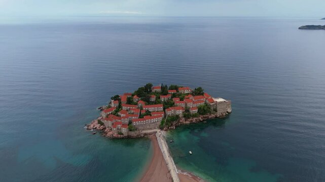 Aerial drone view Sveti Stefan Budva Kotor Montenegro Adriatic Sea Mediterranean Medieval town blue sea water Vacation Holiday Europe 