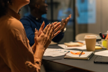 People applauding at meeting