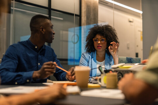 Confident businesswoman sharing her ideas with colleagues