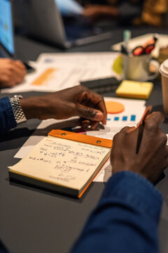 Businessman making notes during important meeting