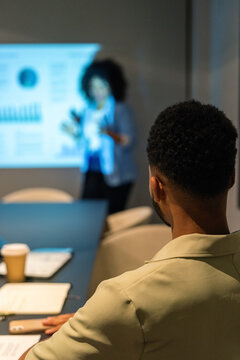 Man listening to a speaker during presentation