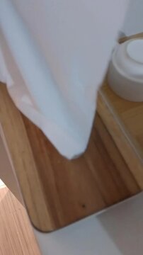 empty wooden table in the living room with man Taking tissue