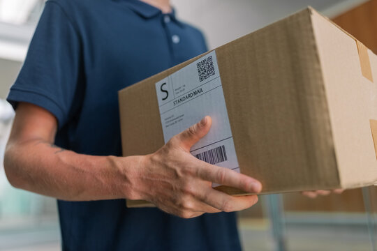 Postman carrying package