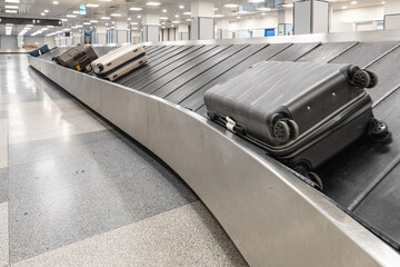 Baggage Arriving on Conveyor Belt at Airport Terminal