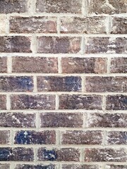 Closeup of a dark gray brick wall.