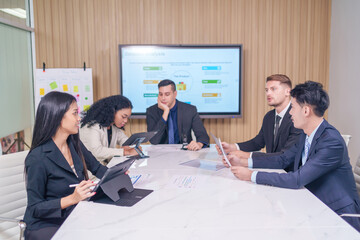 multiracial business team at work together,board meeting to analyze and discuss the situation on the financial report in the office