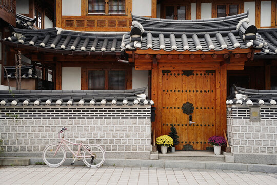 Facade of traditional Korean house with bycicle parked next to it